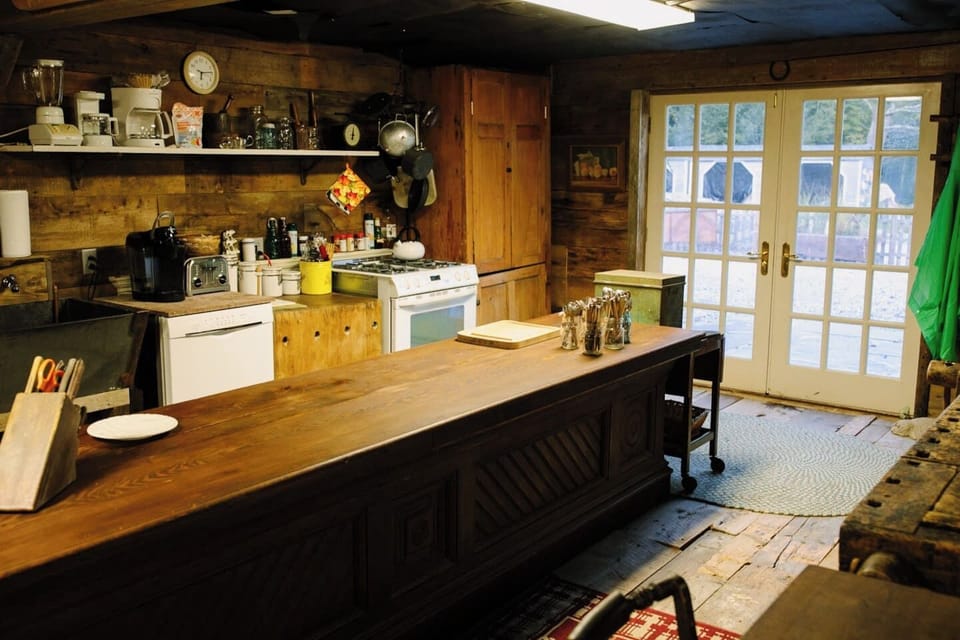 Entrance and huge kitchen with old country store counter center island.