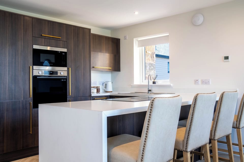 Kitchen area with breakfast bar