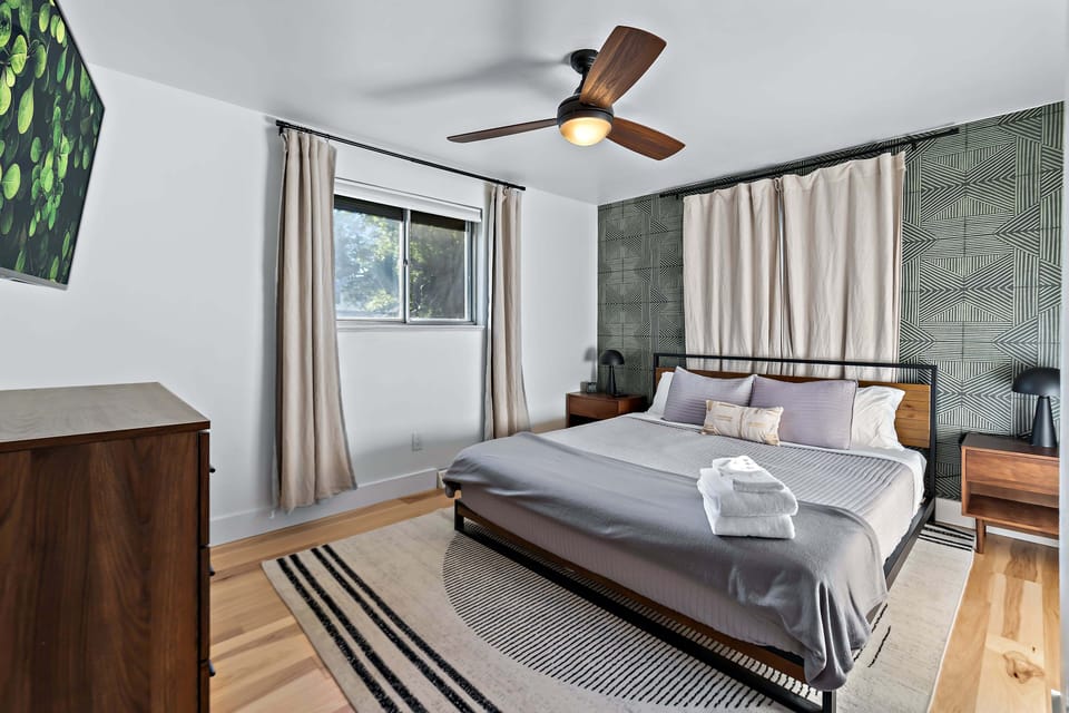 Upstairs Bedroom, king bed and wall mounted tv
