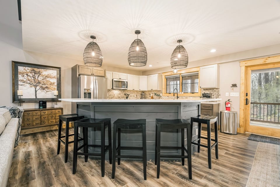 The roomy kitchen island has seating for 5.