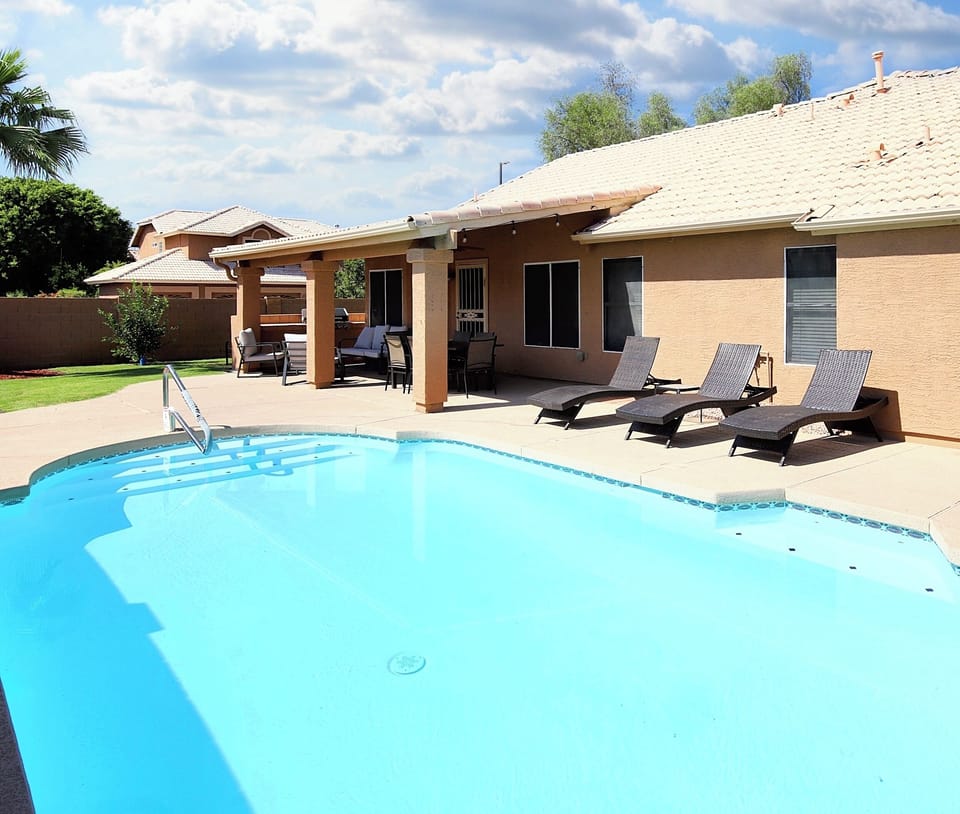 Backyard Pool: Refreshing pool with floats, toys & basketball hoop fun