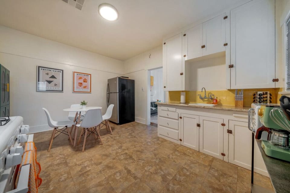 Updated, well-equipped kitchen and dining area, situated between the bedroom and living room