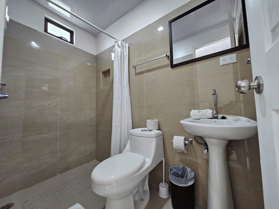 Shower, rainfall showerhead, hair dryer, towels
