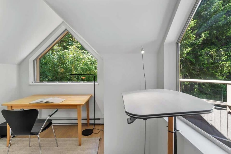 - Peaceful corner workspace overlooking lush Whistler forest  
- Bright desk setup ideal for remote work or journaling time  
- Relaxing setting with nature views right outside your window  