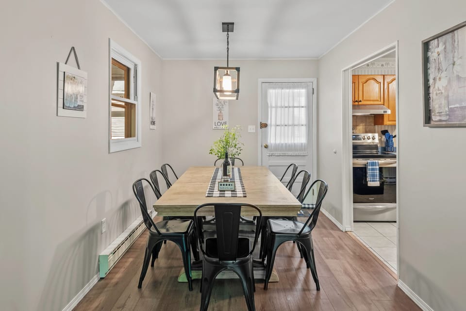 Gather around for delicious meals and great conversations at our dining table.