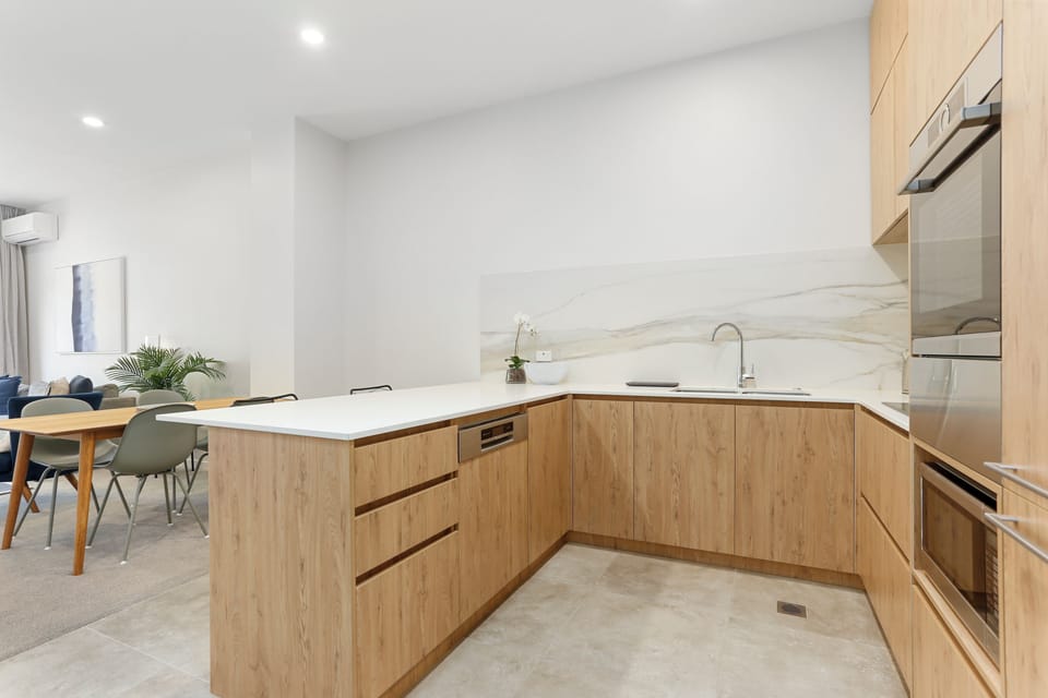 Two Bedroom Apartment with Parking | Private kitchen | Coffee/tea maker, toaster, dining tables