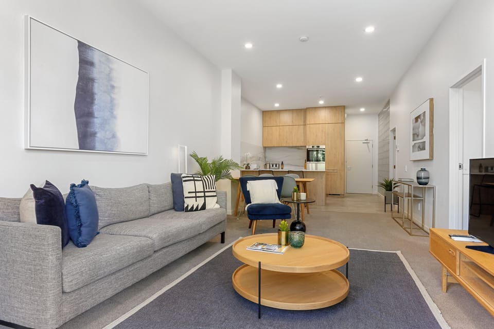 Two Bedroom Apartment with Parking | Living area | 55-inch Smart TV with digital channels