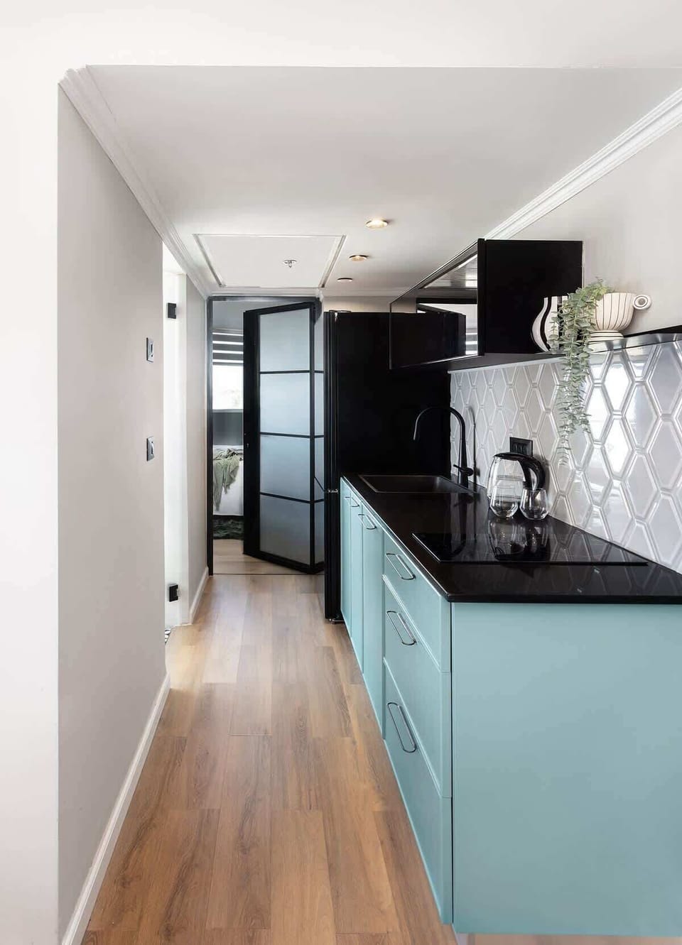 A fully equipped kitchen makes the apartment perfect for both short and long stays. The kitchen features a full-size refrigerator and freezer, an induction stove, a microwave, a Nespresso machine, cooking ware, and more.