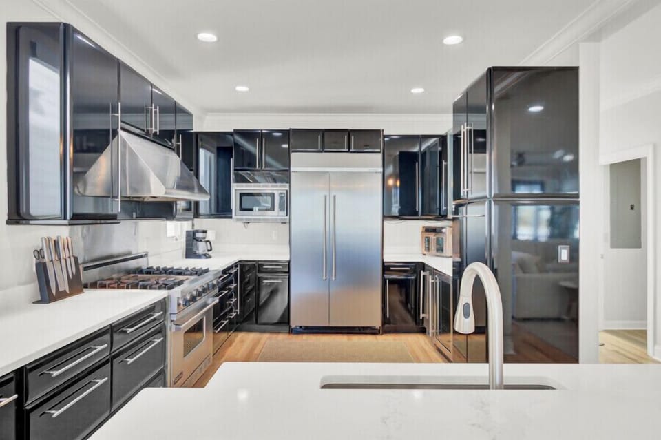 Your sleek modern kitchen features high-end stainless steel appliances and glossy cabinets for effortless meal prep.