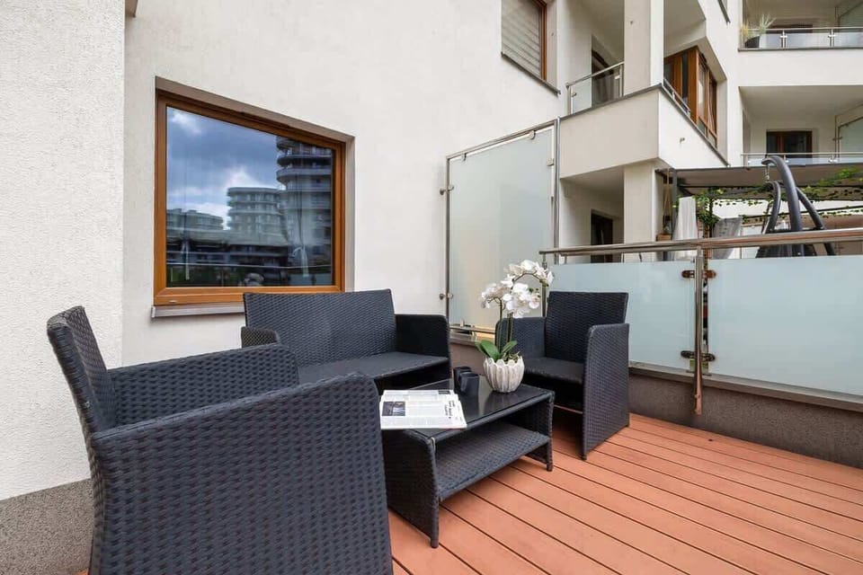Furnished terrace with outdoor seating
Comfortable rattan furniture on the private balcony, perfect for coffee.