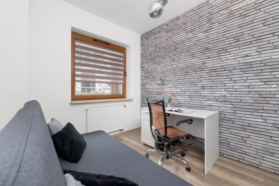 Bedroom with a space for remote work.