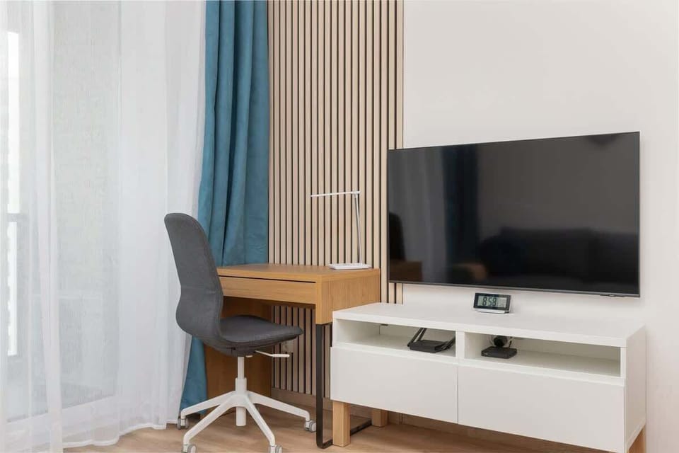 A dedicated work corner featuring a sleek desk and comfortable chair, ideal for remote work or study.
