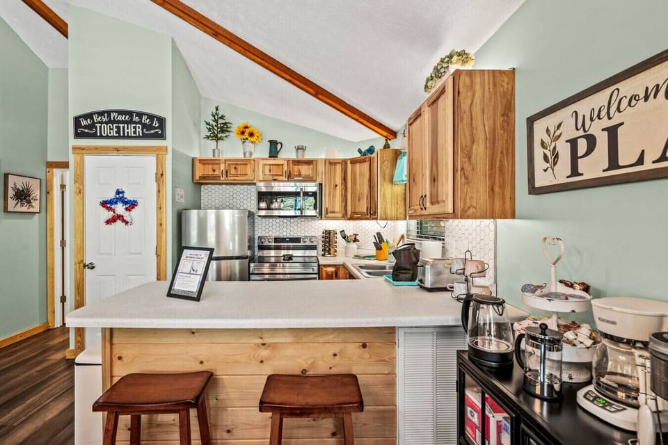 There are two additional bar stools at the kitchen bar for extra seating.