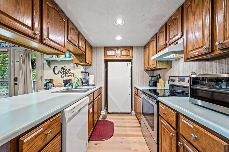 The fully-equipped kitchen includes all of the amenities that your group needs to enjoy a meal in or take-out from the local Gatlinburg restaurants.