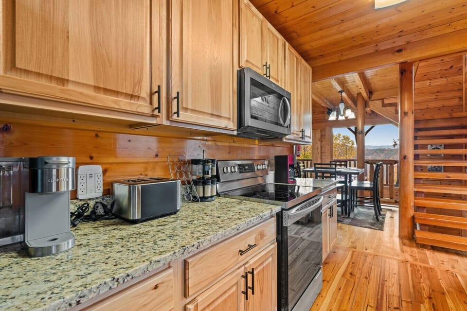 The kitchen includes stainless steel appliances, dishware, silverware, cookware, utensils, a knife set and more.
