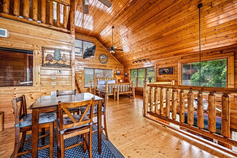 The loft area includes an additional dining table that is the perfect spot for board games, playing cards, or spending time connecting with friends and family.