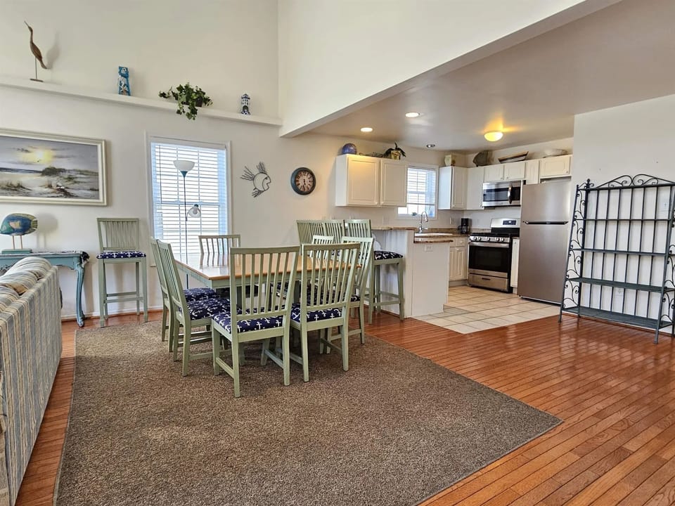 Enjoy a meal at our large dining room table with extra seating at the kitchen ba