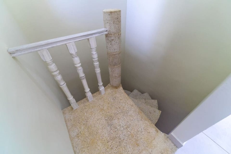 Ascend to comfort: Our inviting stairway welcomes you