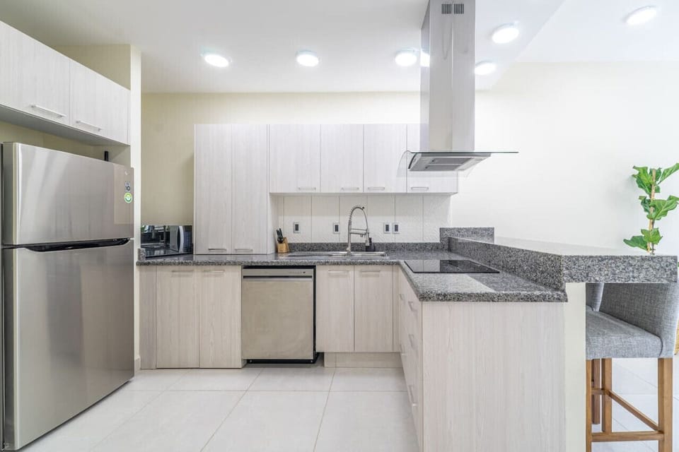 Fully equipped kitchen and stylish mini bar for your convenience
