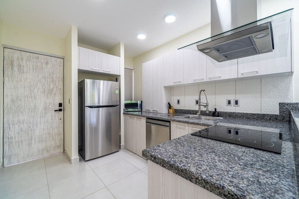 Fully equipped kitchen with modern appliances and ample counter space