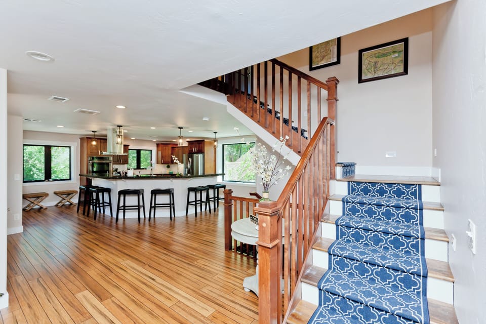 Stairs leading up to 4 bedrooms and 2 full bathrooms