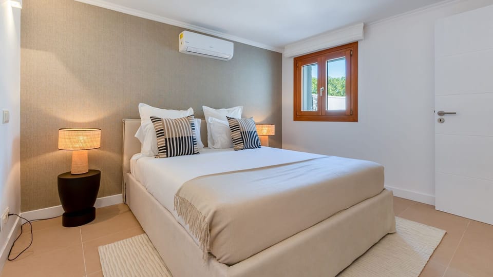 Sink into the plush comfort of your king-sized bed, surrounded by soothing tones for a perfect night's rest.
#Bedroom #KingBed #LovelyStay