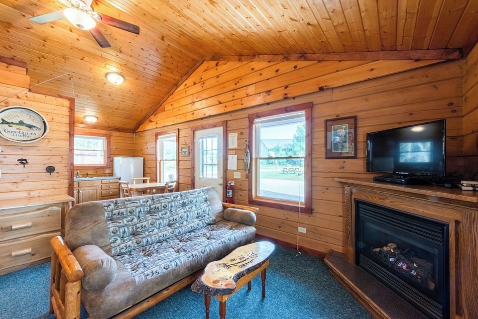 Cedar Cabin Living Space

Enjoy the amenities of home in the quaint 2 bedroom log cabin.  This is a view into the kitchen, big enough to cook & enjoy meals or small enough if you would rather leave the mess to someone else and eat out!    The log cabins on the Ranch all have gas fire places.  They are nice to enjoy watching the fire, but they are also an alternative heat source for the cabin!  