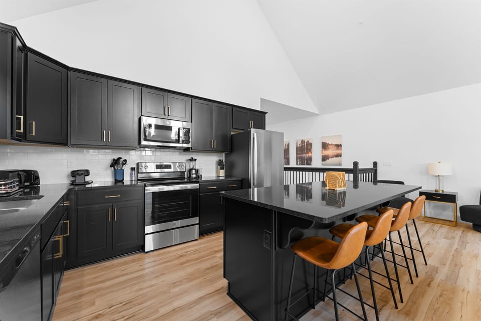 Whether you're preparing a cozy breakfast or a gourmet dinner, the kitchen's rustic charm and contemporary style make every moment spent cooking a pleasure