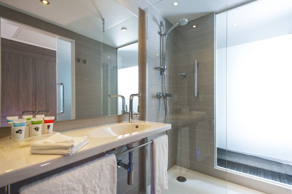 Shower, eco-friendly toiletries, hair dryer, towels