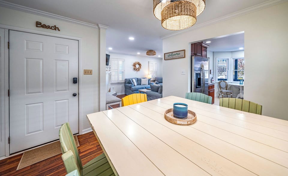 Welcoming open-concept layout with beachy dining table