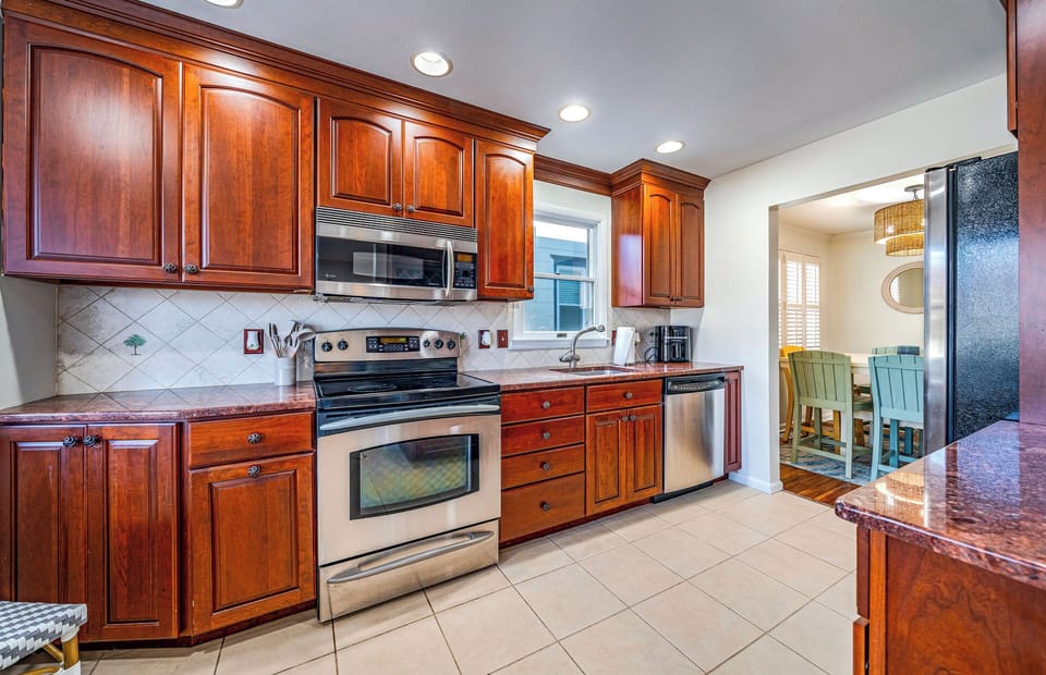 Spacious fully equipped kitchen with stainless steel appliances