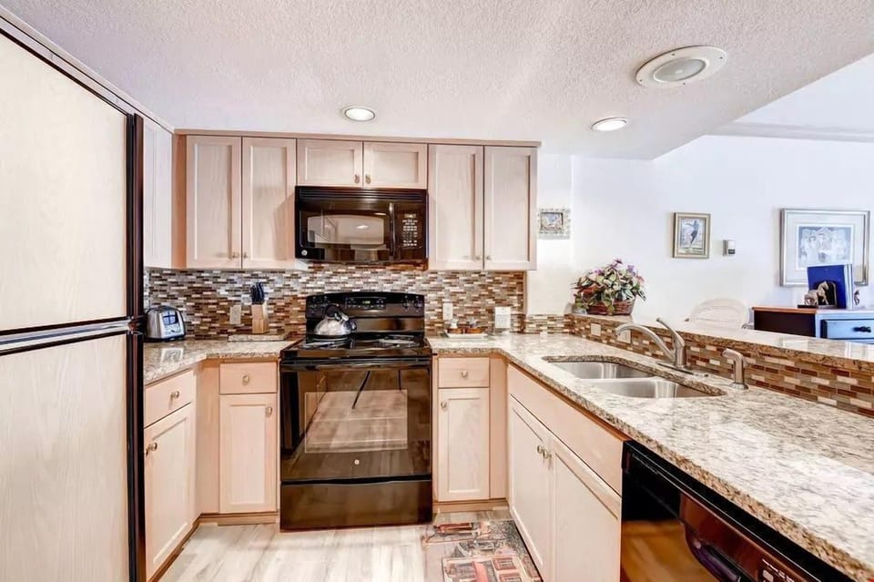 The 1 Bedroom Condo features a fully-equipped kitchen