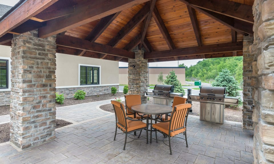 Outdoor BBQ and grilling area with patio seating.