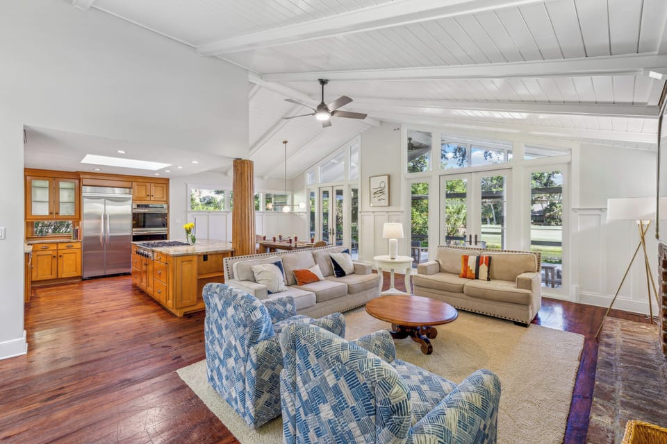 Venture upstairs to the main living area, where an open floor plan effortlessly merges the living room, chief's kitchen, and dining room.