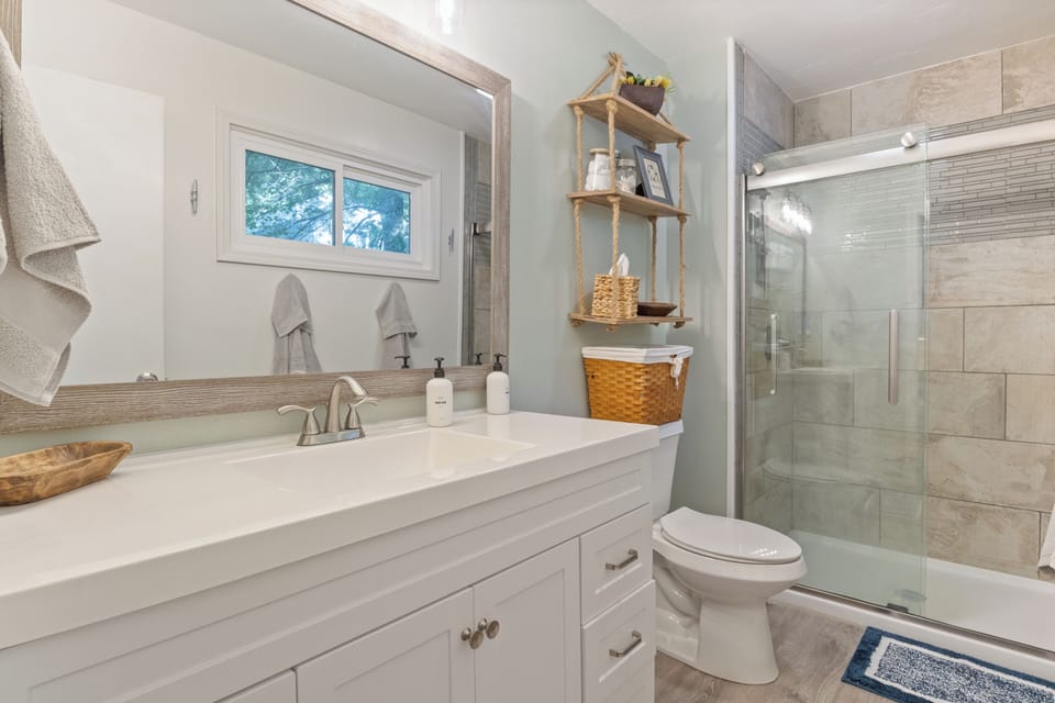 Master ensuite bathroom with a walk-in shower and a single sink.