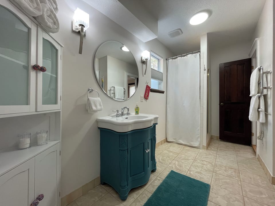 Spacious room with heated towel bar.