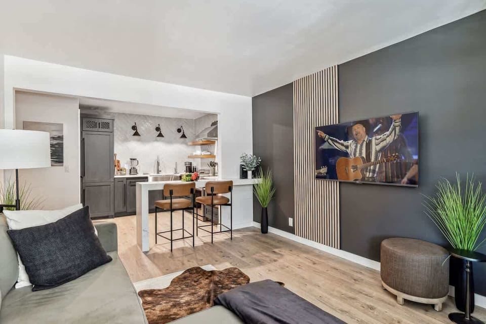 Warm and cozy living room featuring a Smart TV for entertainment and designer furnishings.