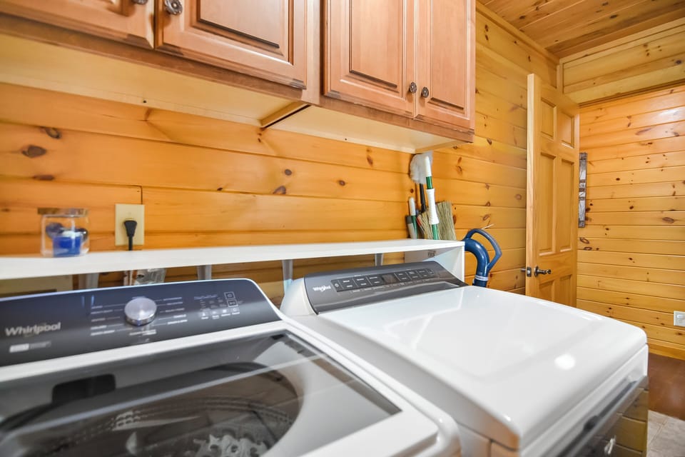 A laundry area with a washer and dryer for a functional stay!