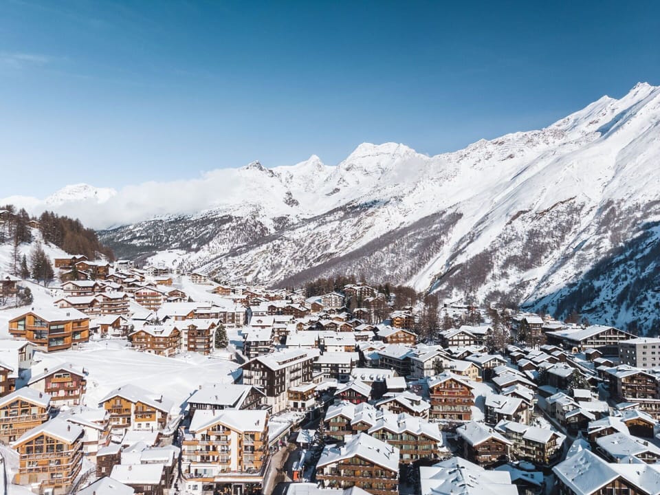 Sky, Snow, Mountain, Cloud, Slope, Natural Landscape, Landscape, Mountainous Landforms, Geological Phenomenon, City