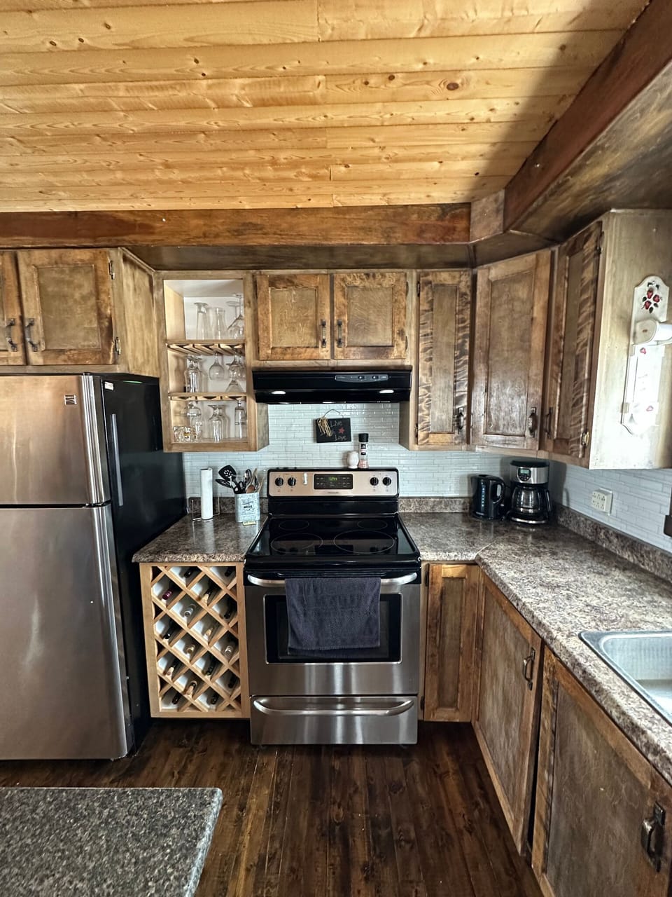 Fully stocked kitchen with fridge, stove, dishwasher, microwave.