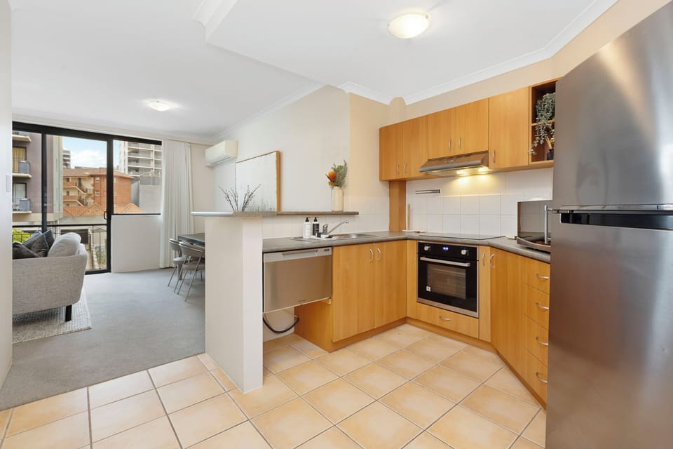 Kitchen amenities include a coffee machine, toaster, kettle, and other appliances, for guests who love to start their day with a homemade breakfast.