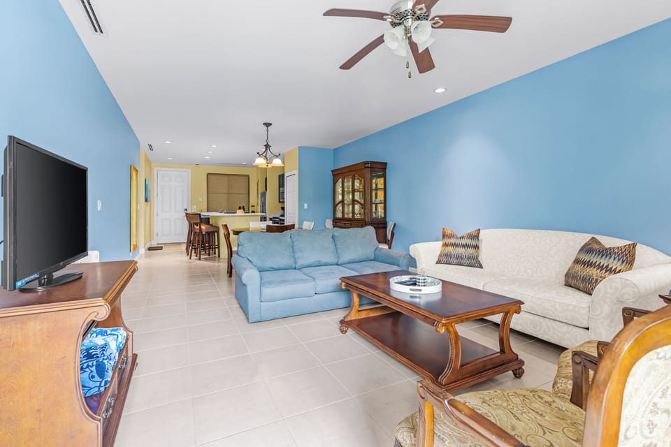 The living room is designed for relaxation, offering a plush couch, a sleeper sofa, and a 46" Smart TV for your entertainment.