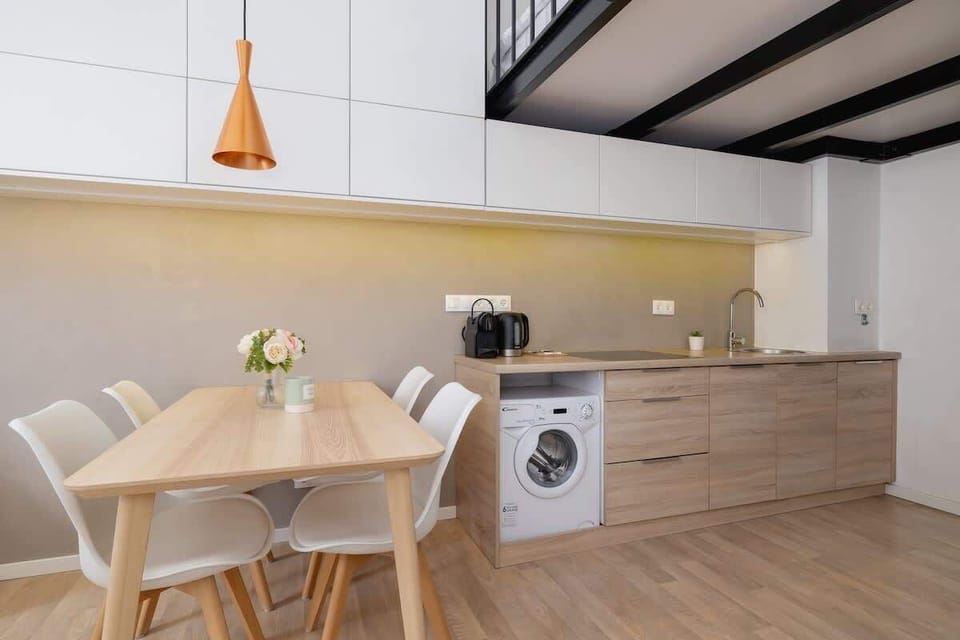 Dining area with modern chairs and pendant light – Ideal for sharing meals or working remotely.

