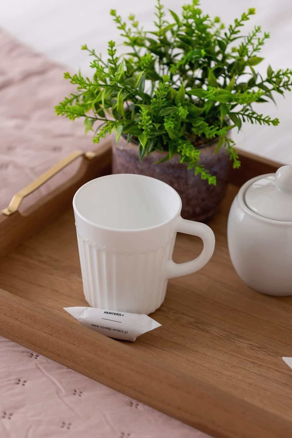 Wooden breakfast tray with a cup of tea.
