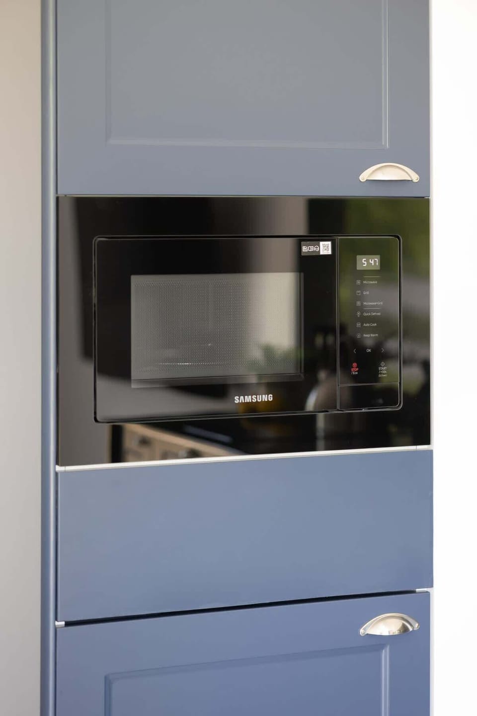 The kitchenette's practical layout maximizes space and functionality.
