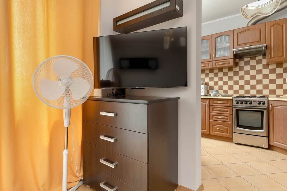The kitchen's contemporary decor complements the studio's style.