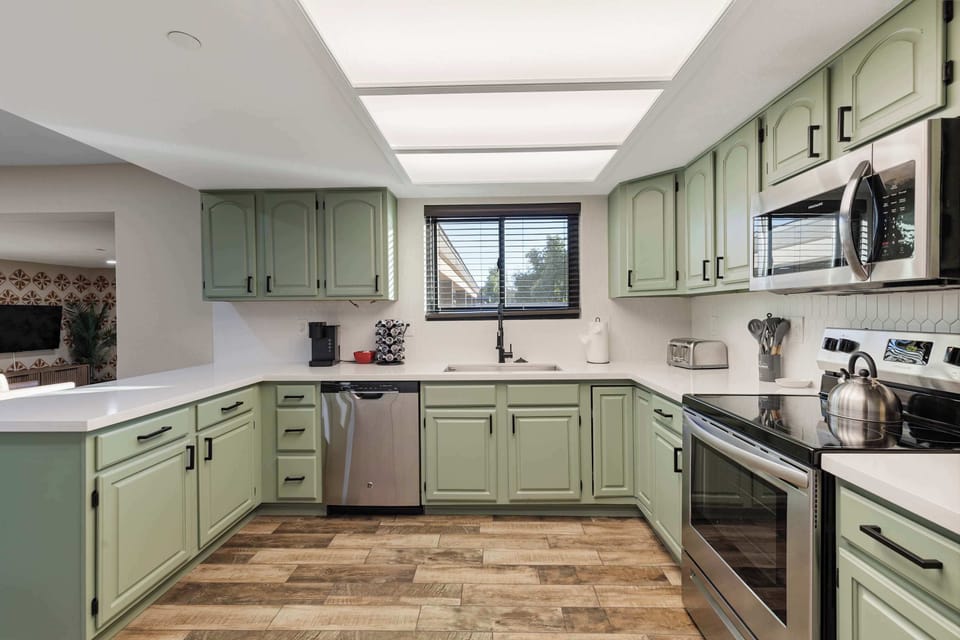 The kitchen is well equipped with modern amenities.