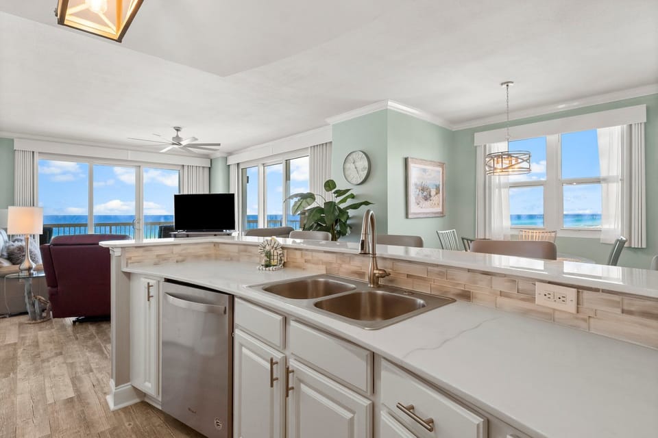 The updated kitchen features a large kitchen island, granite countertops, stainless-steel appliances, spacious pantry, and everything you need to prepare meals for family & friends.