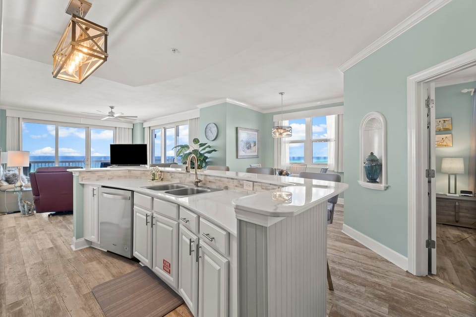 The updated kitchen features a large kitchen island, granite countertops, stainless-steel appliances, spacious pantry, and everything you need to prepare meals for family & friends.