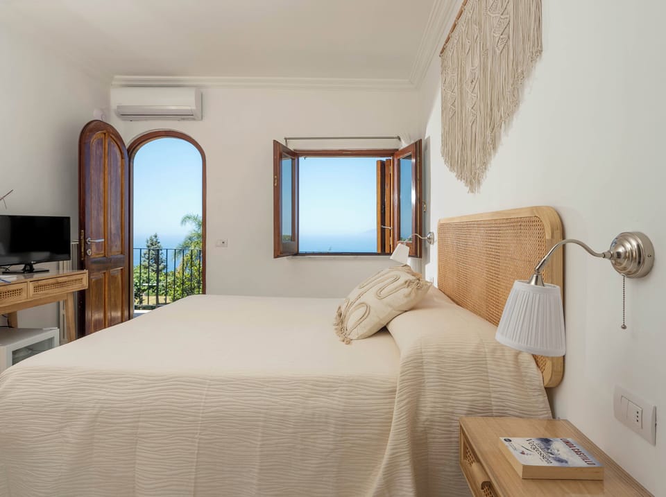 Standard Double Room, Sea View | Minibar, in-room safe, desk, free WiFi